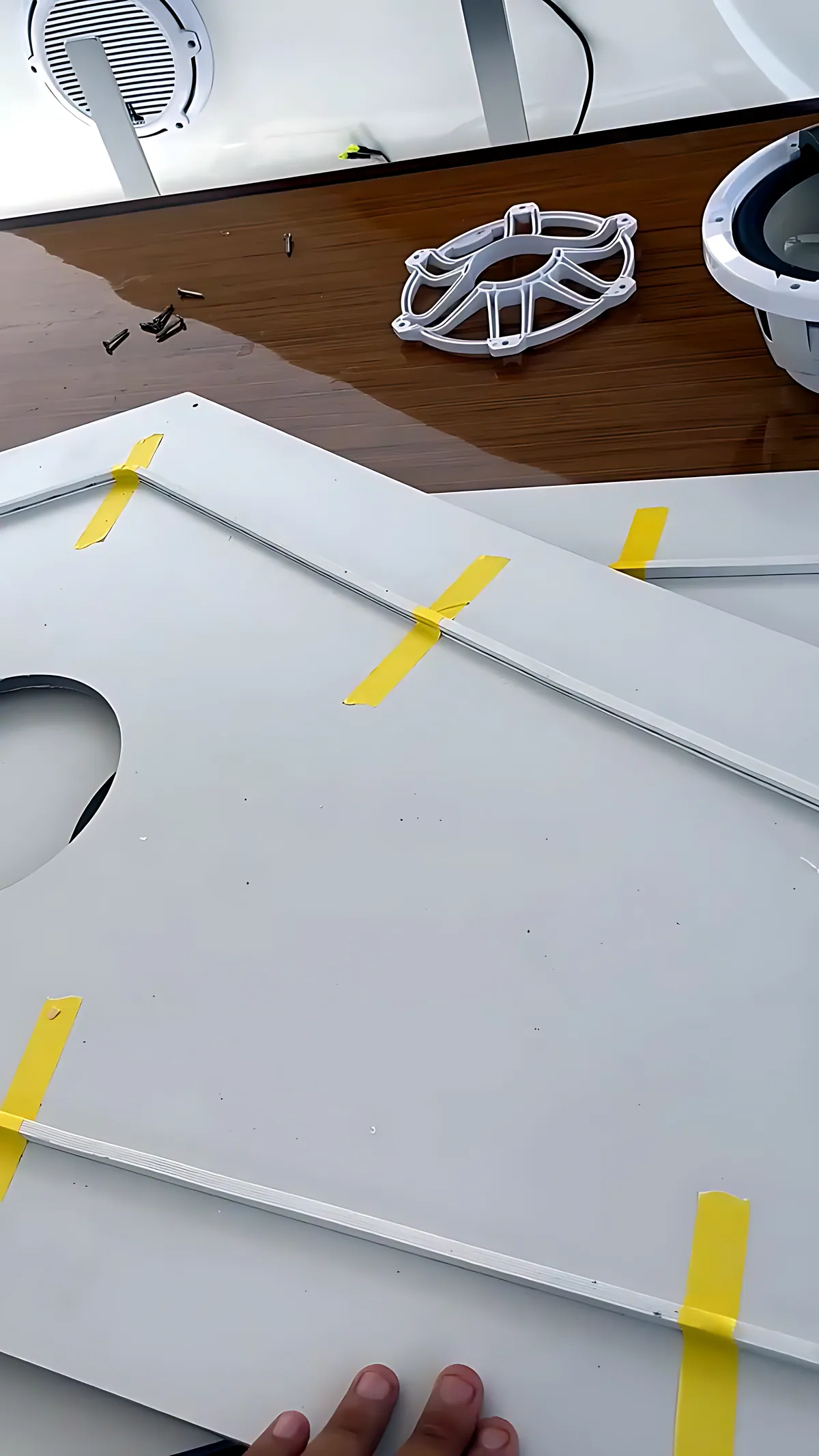 Custom white panel prepared for marine speaker installation